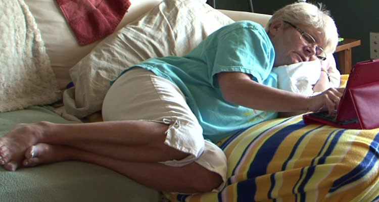 Burnup has to spend most of her day lying down to cope with the pain. She says she used be an active person and feels her life is wasting away. (CBC)