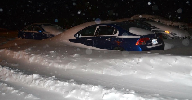 Saturday's storm meant vehicles parked in the parking lot were treated to this snow drift. (Submitted by Frank Isherwood) Image Courtesy of CBC News 