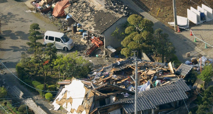Collapsed houses caused by a powerful and deadly earthquake are seen in Mashiki town, Kumamoto prefecture, southern Japan. (Kyodo via Reuters)