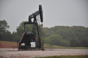 Hydraulic fracturing sites dot the landscape near Guthrie, Okla. The historic town has been shaken by hundreds of earthquakes that are damaging homes and heritage brick buildings on its main street. (Terry Reith/CBC)